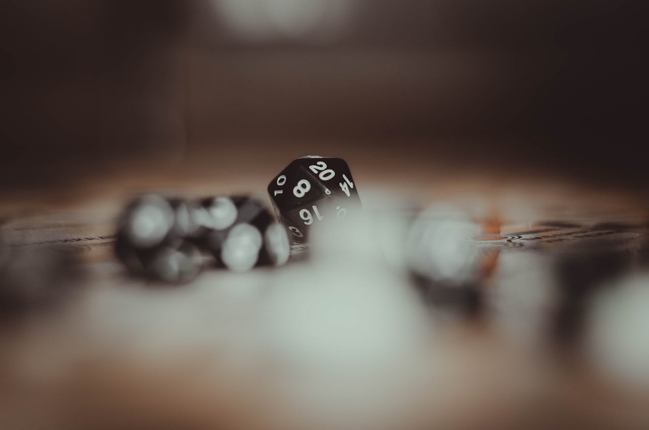 digital-01 Artistic photo of multi-sided gaming dice in a blurred setting, highlighting the number 20.